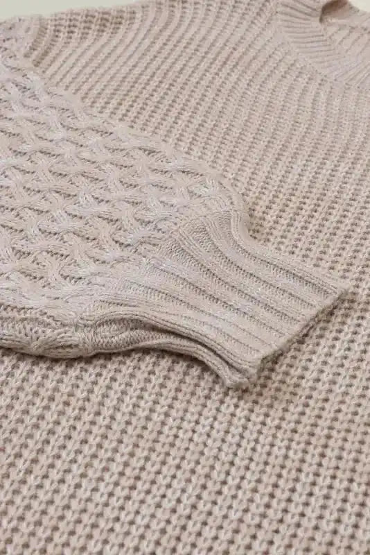 Detailed view of Beige Cable Knit Sleeve Drop Shoulder Sweater sleeve showing cable-knit pattern and ribbed cuff.