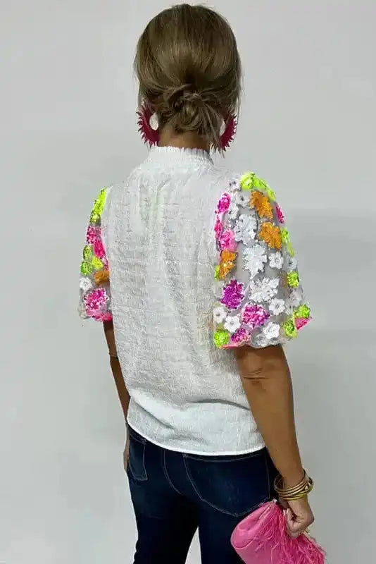 Back view of Sequin Flower Crinkle Smocked Collar Puff Sleeve Top showing relaxed silhouette — Fashionfitz