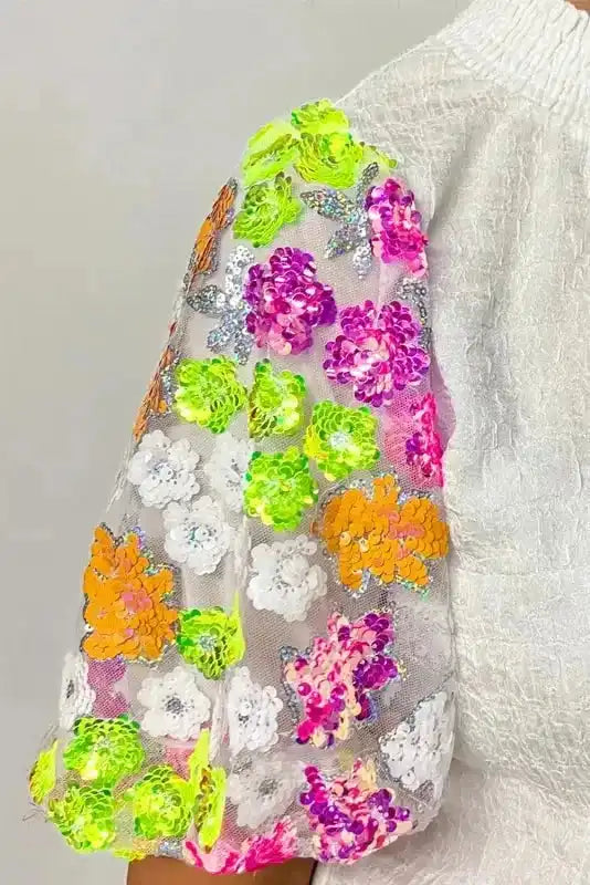 Detail view of Sequin Flower Crinkle Top showing sequin flower embellishments on crinkle-textured fabric — Fashionfitz