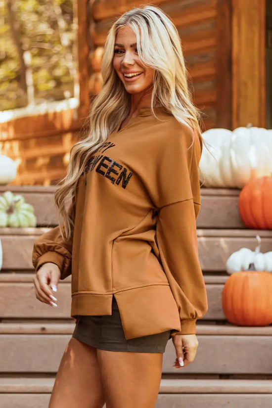 Side view of chestnut Sequin Halloween Top with split hem and sequin lettering, styled for casual fall fashion.