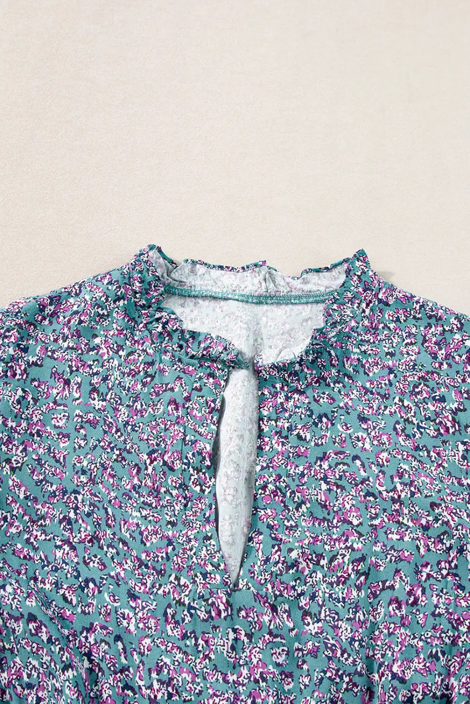 Floral print blouse with keyhole neckline in teal and pink, perfect for a relax relax day