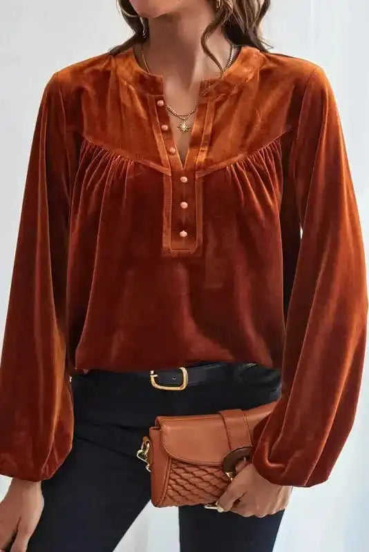Front view of rust orange Skobeloff velvet blouse styled for fall or winter elegance with soft velvet texture.