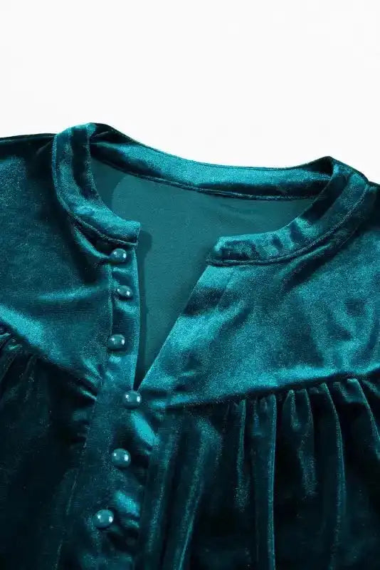Close-up of neckline and buttons on Skobeloff velvet blouse, highlighting its V-neck and gathered design.