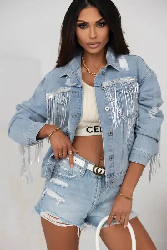 Woman wearing sky blue sequin fringe distressed denim jacket front view Fashionfitz UK