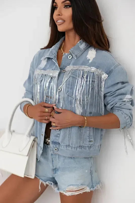Close-up of sequin tassel fringe and ripped distressed detail on denim jacket Fashionfitz UK