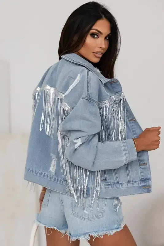Side view of sequin tassel embellished distressed denim jacket showing fringe detail Fashionfitz UK