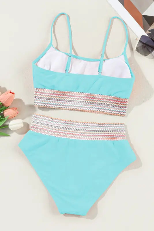 High waist bikini swimsuit with striped patchwork in turquoise and multicolored zigzag pattern