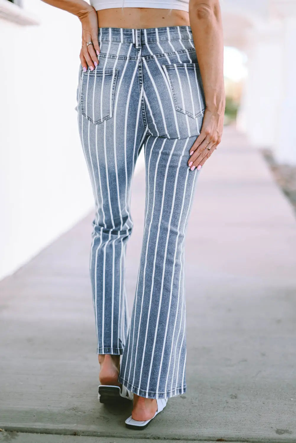 Sky blue vertical striped ripped flare jeans
