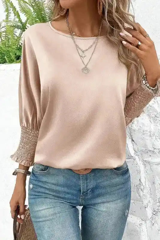 Stylish Dolman Sleeve Satin Blouse in smoke gray with shirred cuffs, paired with casual denim and accessories for a refined outfit.