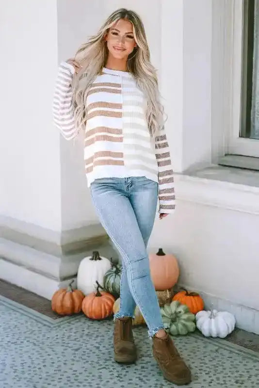 Full outfit featuring neutral tone drop shoulder sweater paired with jeans and boots, styled for a cozy fall look.