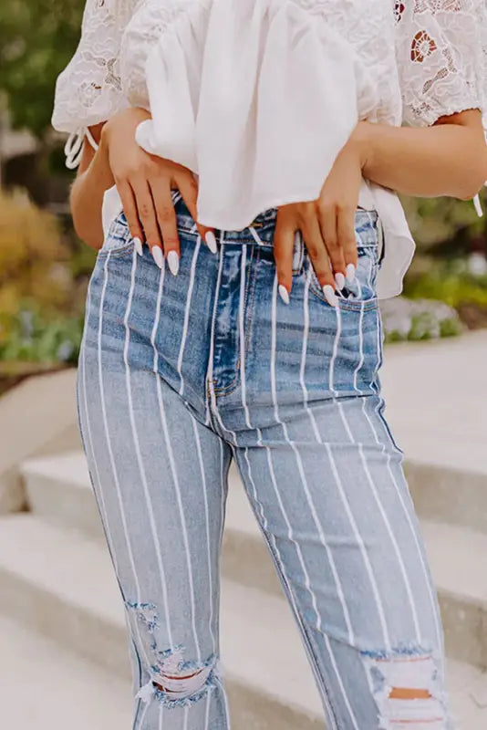 Striped ripped flare jeans