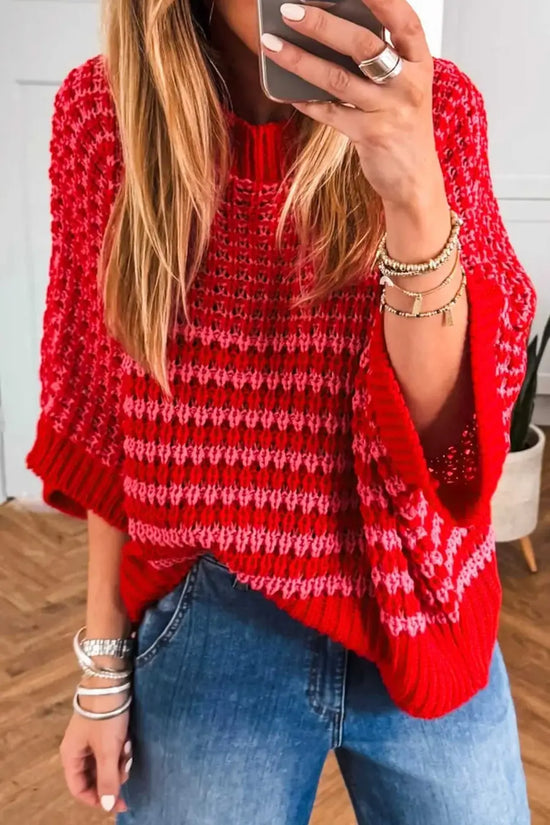 Red and pink striped soft-knit slouchy jumper for women, styled with denim. Lightweight short sleeve sweater perfect for summer outfits.