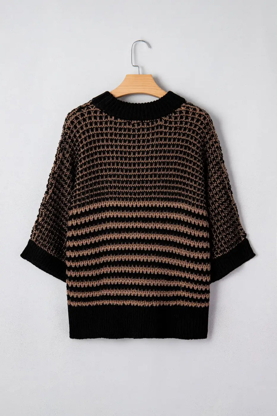 Back view of striped soft-knit slouchy jumper in black and taupe. Lightweight knit with short sleeves and ribbed trim for casual wear.