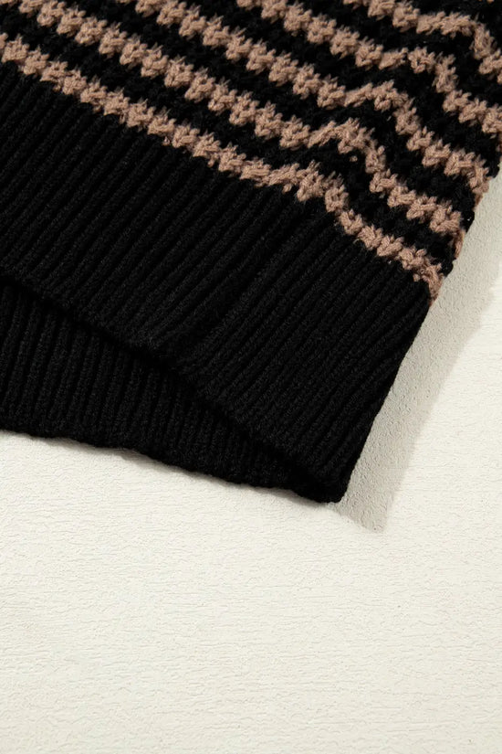 Bottom hem detail of black and taupe striped soft-knit slouchy jumper. Ribbed edge adds structure to this relaxed fit summer sweater.
