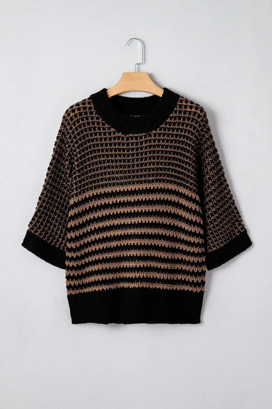 Front view of black and taupe striped soft-knit slouchy jumper on hanger. Short sleeve sweater with ribbed collar and relaxed silhouette.