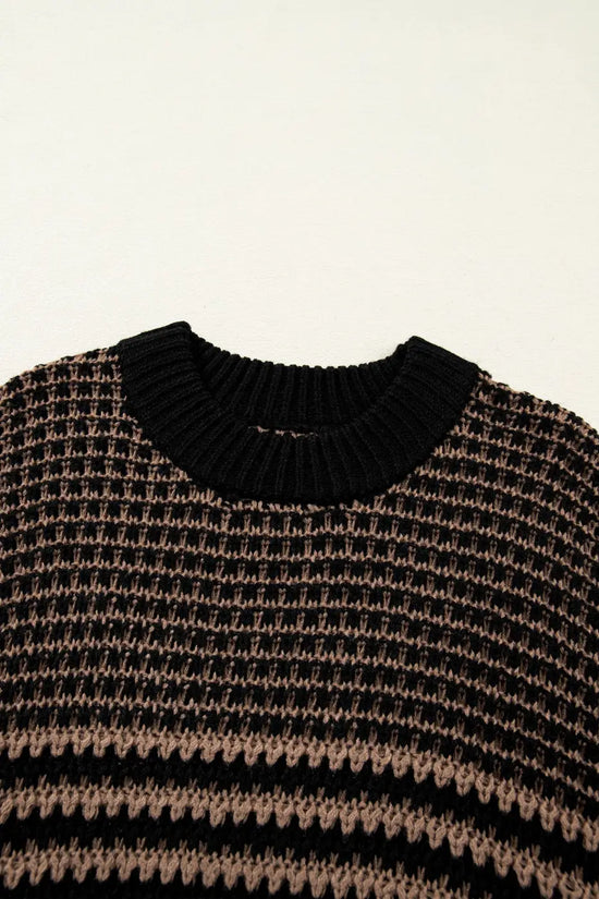 Close-up of ribbed neckline on black and taupe striped soft-knit slouchy jumper. Comfortable and stylish short sleeve sweater for women.