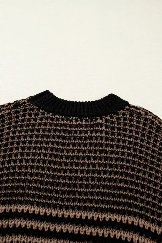 Back neckline detail of black and taupe striped soft-knit slouchy jumper. Features ribbed collar and breathable knit for summer comfort.