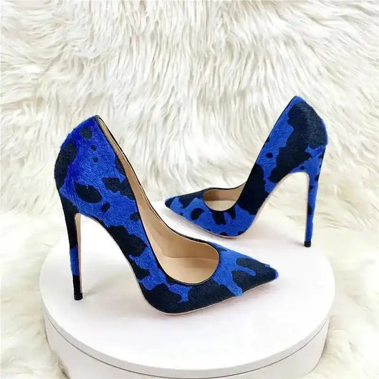 Pair of Blue‑Black Graffiti Suede Heels with bold pattern and high stiletto heel. Fashion-forward pumps for women’s footwear.