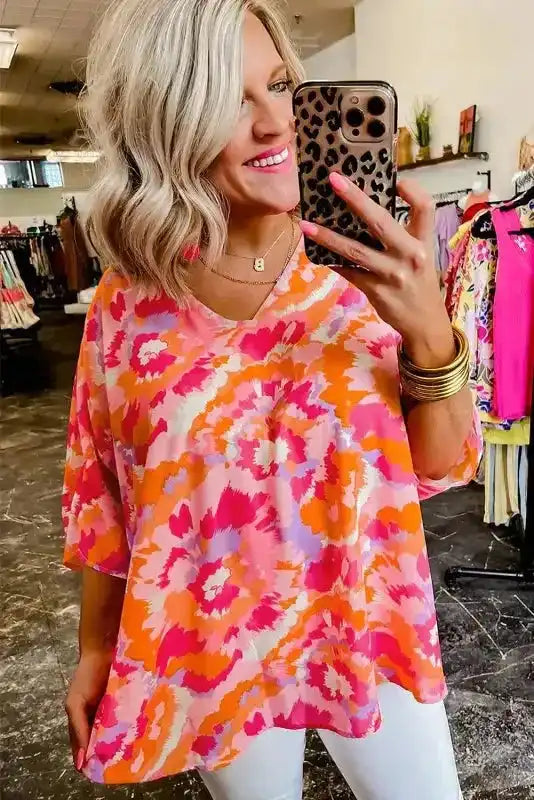 Back view of Rose Red Abstract Print V-Neck Blouse showing shirred detail and relaxed shift silhouette — Fashionfitz