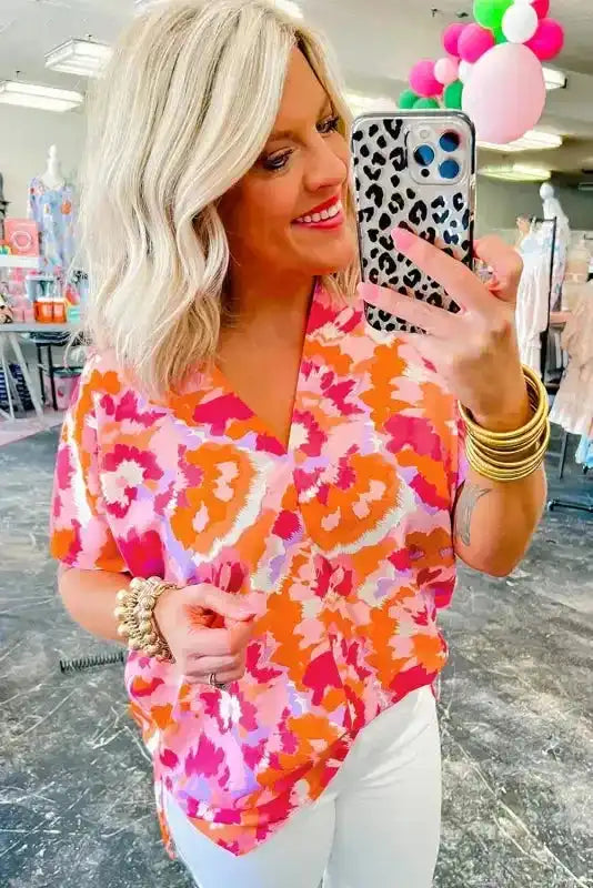 Side view of Rose Red Abstract Print Summer Blouse showing V-neckline and lightweight polyester drape — Fashionfitz