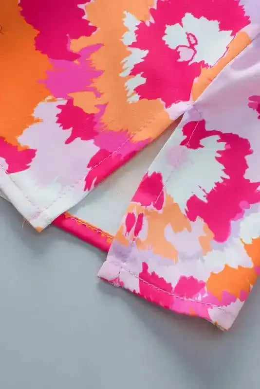 Vibrant Rose Red Abstract Print V-Neck Summer Blouse Women UK styled as a bold casual summer outfit — Fashionfitz
