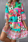 Summer chic mini dress: colorful, patterned mini dress with bell sleeves and tropical print