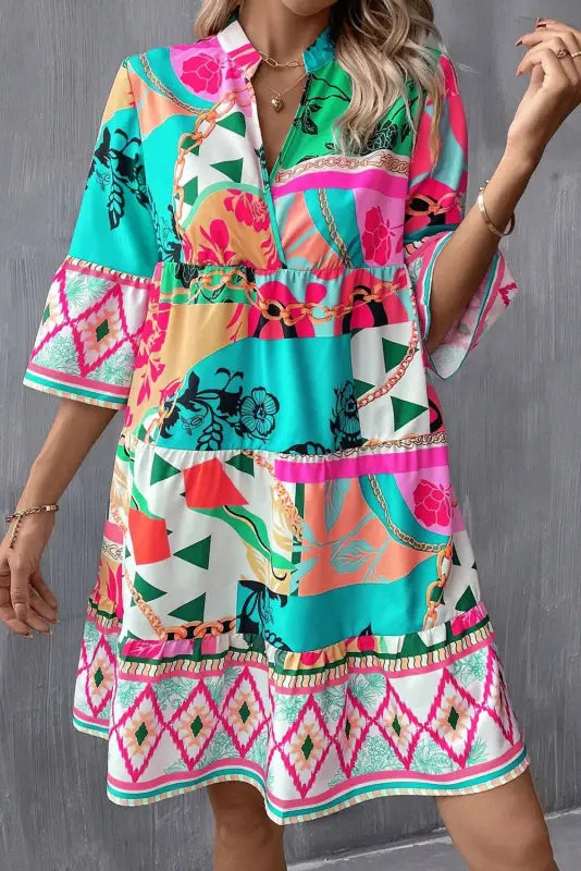 Summer chic mini dress: colorful tropical print with three-quarter length sleeves