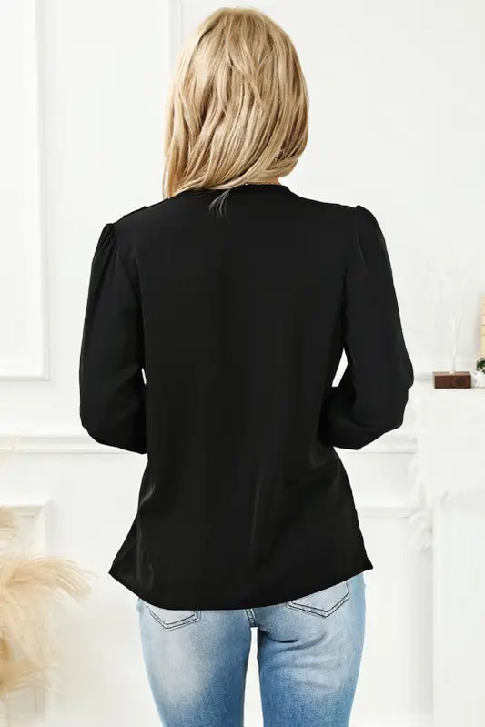 Black solid surplice neck shirred cuffs draped blouse - tops