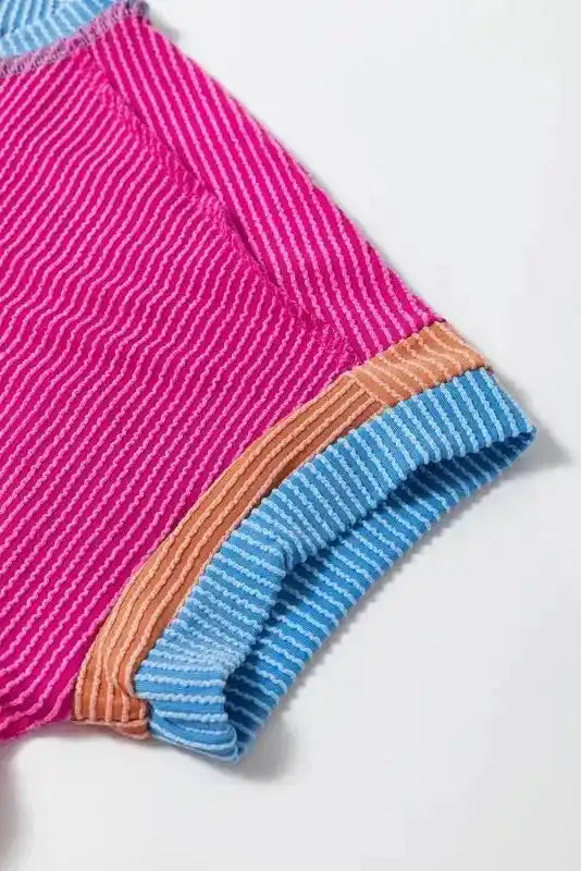 Close-up of Textured Contrast Trim Round Neck T-Shirt showing contrast trim detail on bright pink textured fabric — Fashionfitz