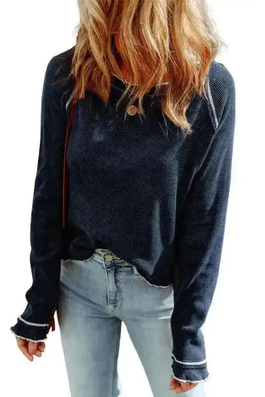 Studio shot of navy blue Round Neck Textured Top on white background, emphasizing its soft knit and relaxed silhouette.