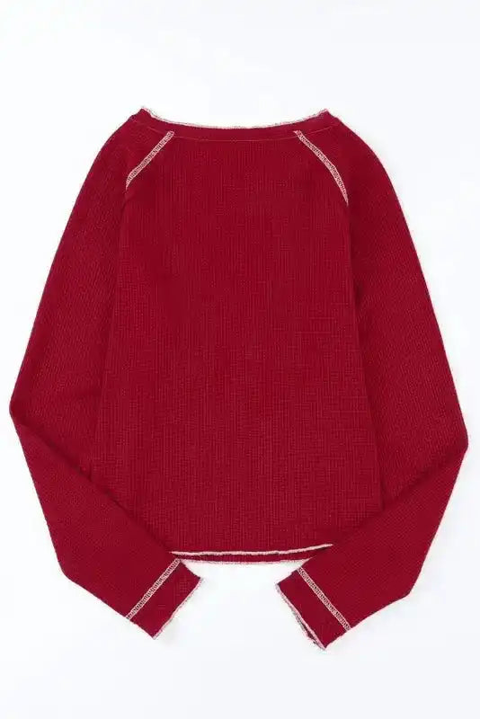 Back view of red Round Neck Textured Top with contrast seams and waffle knit texture, perfect for casual fall and winter outfits.