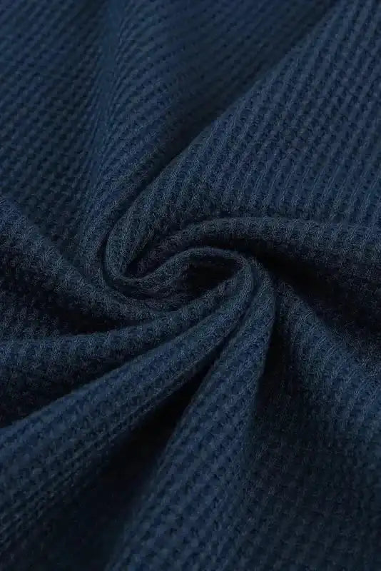 Fabric close-up of navy blue Round Neck Textured Top, showcasing its thick waffle knit texture for cozy fall and winter wear.