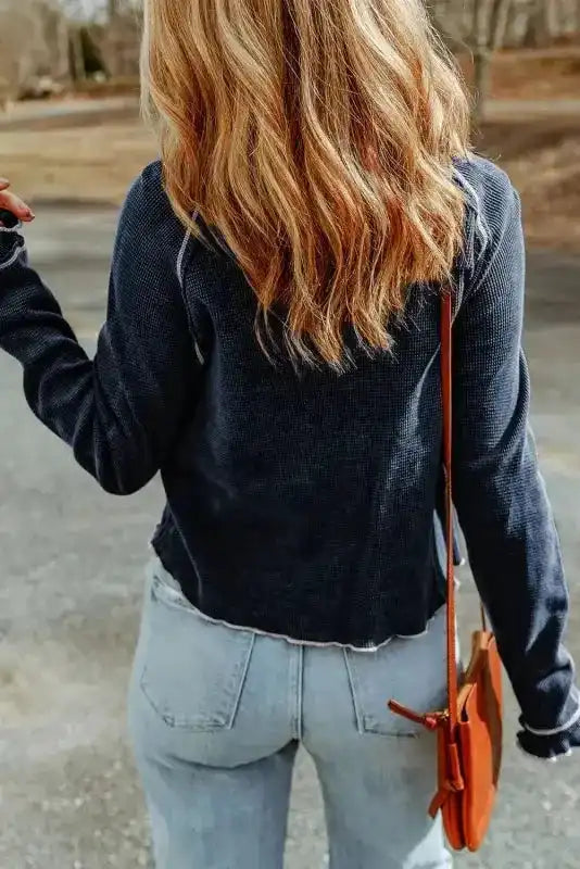 Back view of navy blue Round Neck Textured Top showing its casual cut and textured waffle knit fabric for fall and winter.