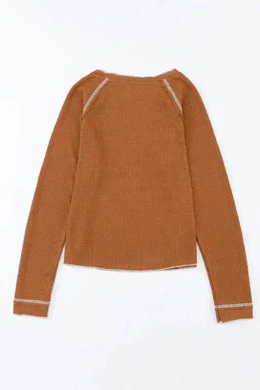 Back flat lay of brown textured long sleeve top, featuring raw seam details and a relaxed silhouette.