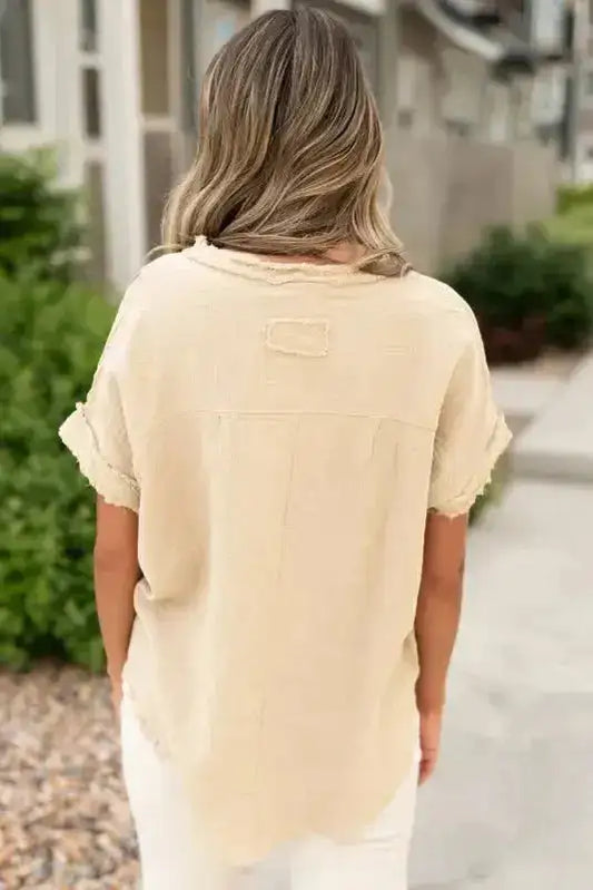 Back view of Crinkle Frayed Tunic Top showing relaxed fit and frayed hem, ideal for feminine summer outfits.