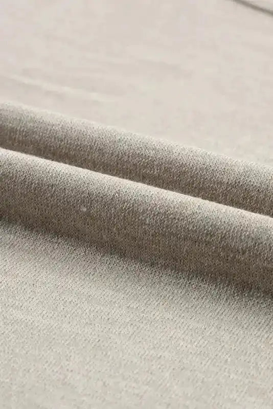 Close-up of soft fabric texture of Smoke Gray Batwing Tee, showcasing its breathable and comfy material.