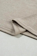 Hem detail of Smoke Gray Batwing Tee, highlighting its neat finish and soft fabric for everyday wear.