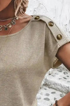 Close-up of shoulder button detail on Smoke Gray Batwing Tee, emphasizing its stylish design element.