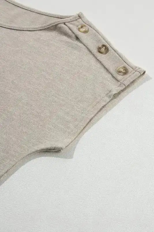 Detailed view of sleeve and button accents on Smoke Gray Batwing Tee, enhancing its casual style.