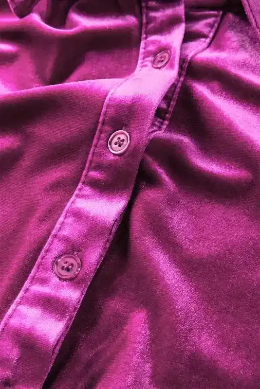 Button detail on rich velvet fabric of the Babydoll Tunic Shirt, enhancing its elegant and soft texture.