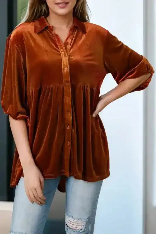 Shop Velvet Tunic Babydoll Shirt in rust orange paired with light denim jeans, featuring a soft velvet texture and puff sleeves.