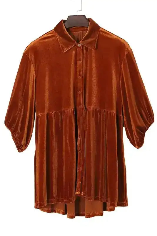Full front view of the rust-colored Velvet Babydoll Tunic on hanger, featuring button-down design and A-line silhouette.