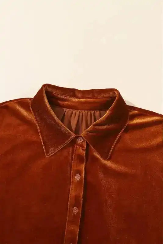 Close-up of collar and button placket on Shop Velvet Tunic Babydoll Shirt in rust velvet, showcasing soft texture and tailored neckline.