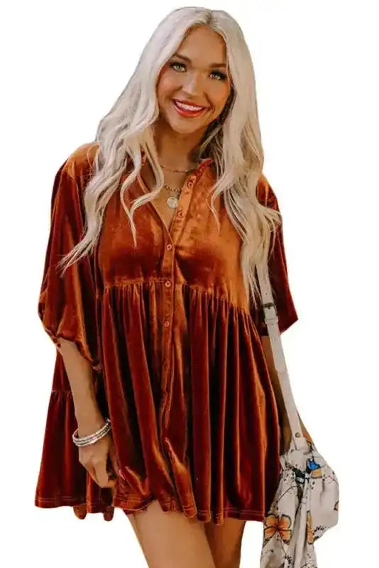 Model wearing rust Shop Velvet Tunic Babydoll Shirt, styled for a casual fall look with loose fit and soft velvet drape.