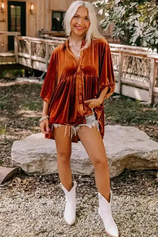 Velvet Tunic Babydoll Shirt in rust orange styled with white boots and shorts, perfect for a fashionable fall outing.