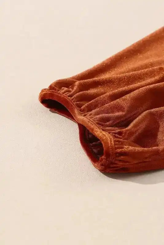 Elastic cuff detail on the Shop Velvet Tunic Babydoll Shirt sleeve, emphasizing the relaxed fit and soft velvet material.