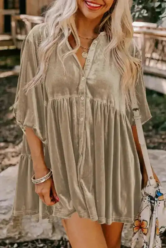Model in khaki Velvet Babydoll Tunic, showcasing the flattering A-line silhouette and button-down front for daily wear.