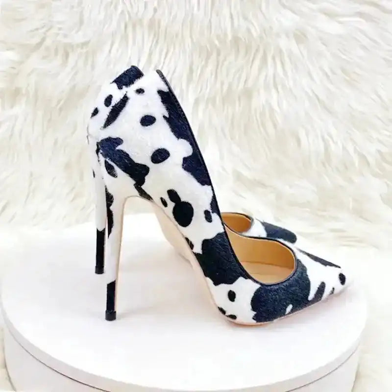 Urban Artistry Stilettos in black and white graffiti pattern with high stiletto heel and PU leather texture, styled for modern chic looks.