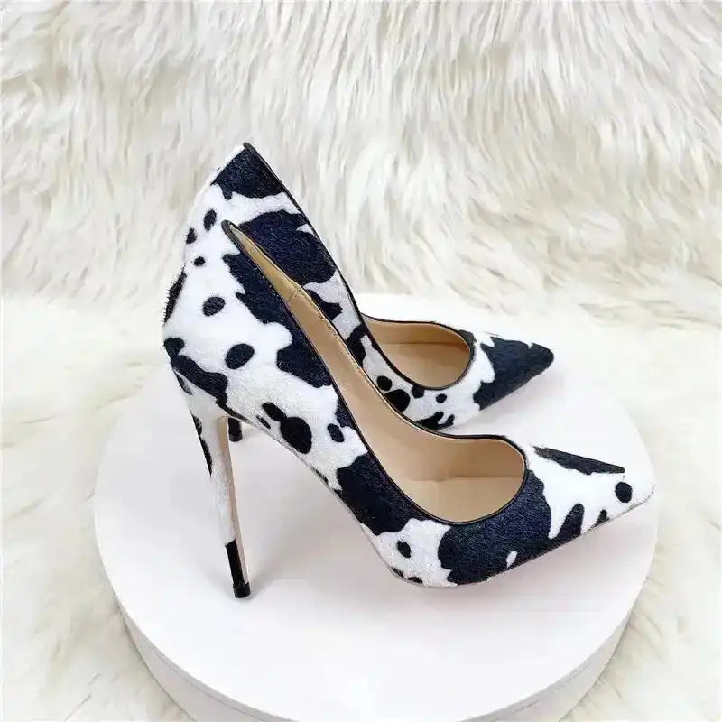 Urban Artistry Stilettos – Black & White Graffiti Heels from FashionFitz with bold abstract print and pointed toe design on faux fur texture.