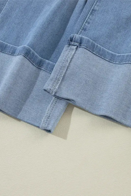 Pair of light blue urban edge asymmetrix jeans with folded cuffs, ideal for a relax relax vibe